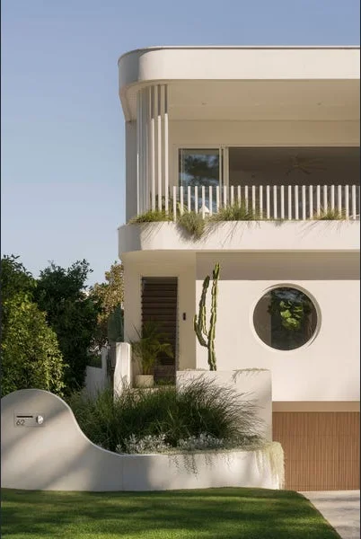 Swanbourne home — curved concrete wall and circular window